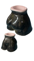 Asstray — Dark Green Gloss Pink Rim, concrete body-form ashtray in dark green/black gloss with pink rim